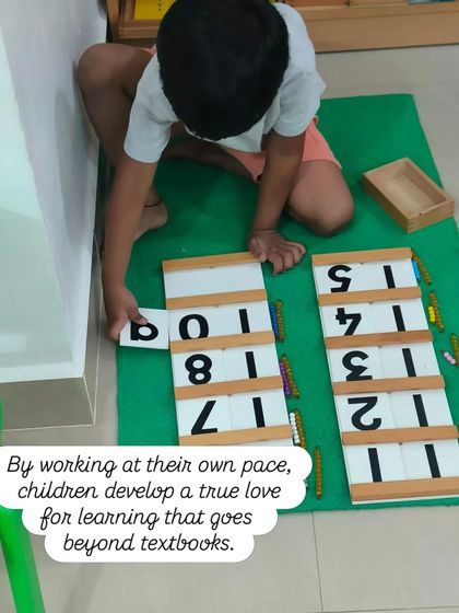 By working at their own pace, children develop a true love for learning that goes beyond textbooks. This child is using the teens and tens boards to understand the decimal system in a concrete way.