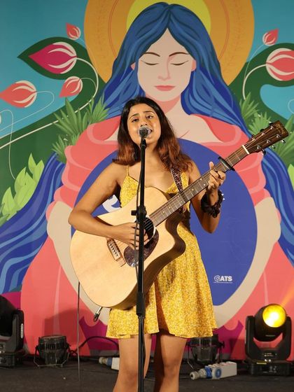 Performing at the Ekatva Festival in Delhi, in front of a beautiful, artistic backdrop that perfectly matched the vibe of the event.