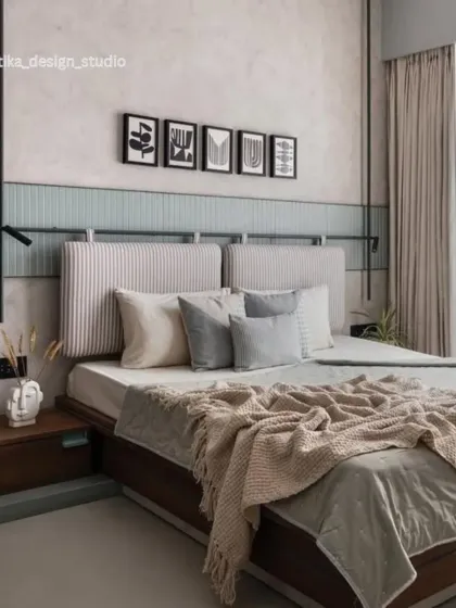 A wider perspective of the Scandi-inspired bedroom, showing how the different elements create a harmonious and restful environment. The layered bedding, minimalist art, and unique bedside lighting contribute to a feeling of cozy, modern sophistication.