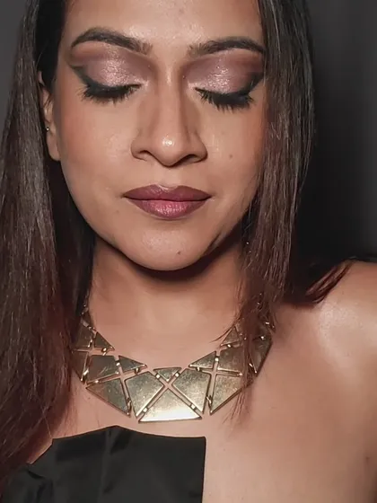 A close-up of a finished glam look, showing the blended shimmer on the lid and the sharp, graphic eyeliner. This is the kind of bold, confident eye makeup we can learn to create.