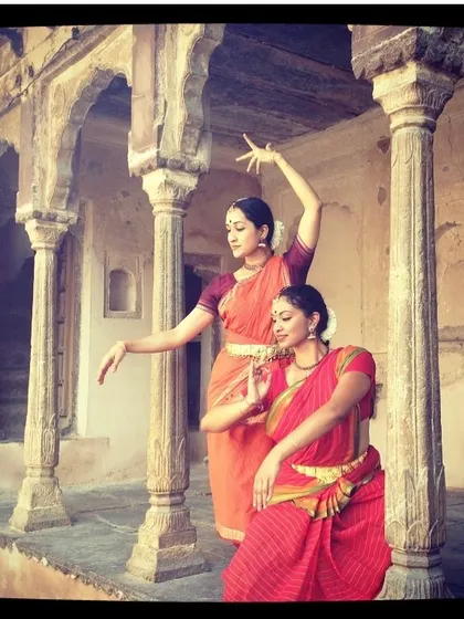 An old photo from a duet photoshoot. The architectural details of the location add a sense of history and timelessness to the dance poses.