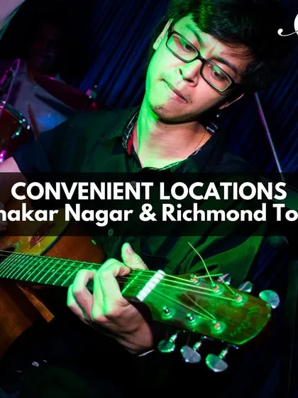 With two convenient locations in Bangalore, our school is accessible for in-person learning. This guitarist is captured during an intense practice session.