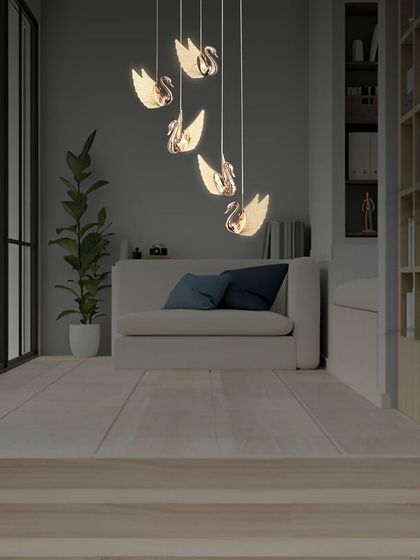 The rose gold swan chandelier is a delicate and artistic piece, perfect for creating a focal point in a living room or a quiet corner.