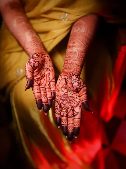 A close-up of the intricate mehendi design, a beautiful part of the pre-wedding traditions.
