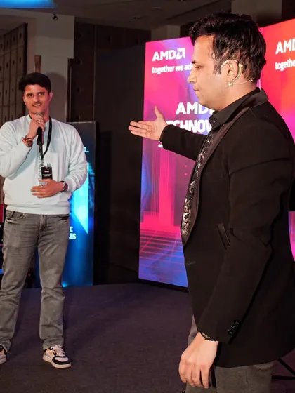 Inviting a volunteer on stage at the AMD Technovation Summit. Audience participation is at the heart of my mentalism shows, making each performance unique.