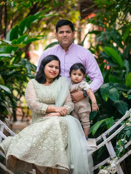 Our studio spaces are perfect for the whole family. This portrait, taken in our outdoor garden area, shows how you can create beautiful family memories that include parents and baby in a relaxed, natural setting.