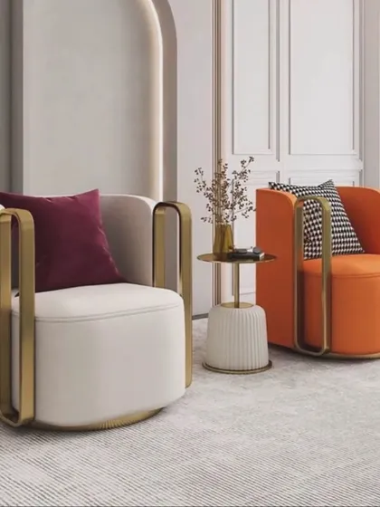Our revolving accent chairs are perfect for flexible seating arrangements. Available in bold colors like orange and classic off-white, they feature a unique metal armrest design.