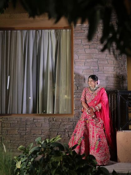 My beautiful bride Avani in a stunning pink lehenga. Her makeup was designed to be fresh and glowing, perfect for her destination wedding.