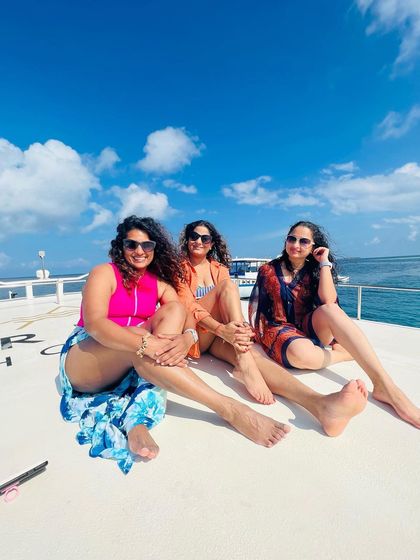 Soaking up the sun on the boat with new friends. These are the moments of connection and laughter that make each trip so special.
