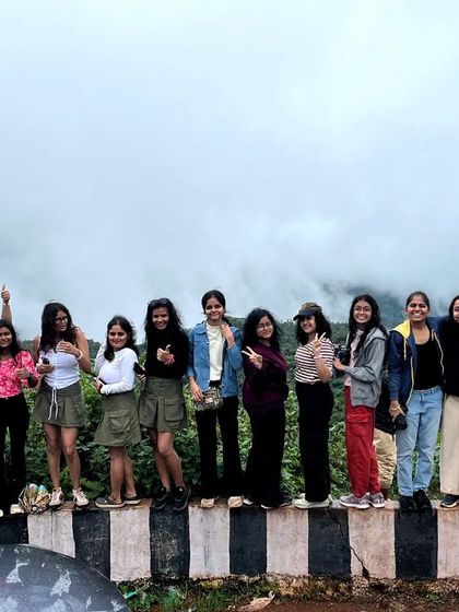 A group of friends enjoying the misty views on our Chikmagalur leisure trip.
