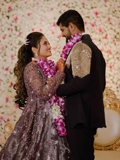 The garland exchange is a key moment in receptions and engagements. I capture the look of love and happiness the couple shares during this tradition.