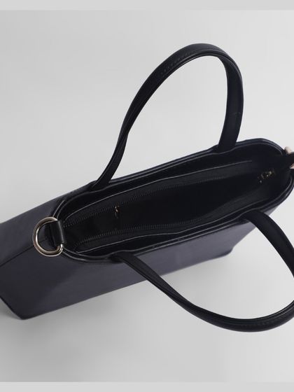 An overhead view of the black handbag's interior.