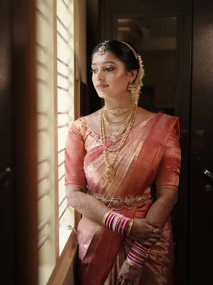 The complete traditional bridal look. I focus on creating a cohesive style where the makeup, hair, and saree draping all work together to create a picture of elegance.