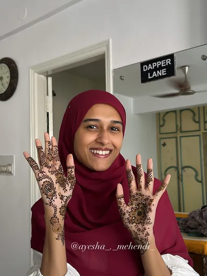 A happy client showing off her fresh henna. Seeing smiles like this is the best part of my job, and it's a pleasure to create designs that bring so much joy.