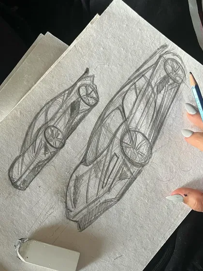 The very beginning of a project. Sketching out car designs on paper before taking it to the real thing.