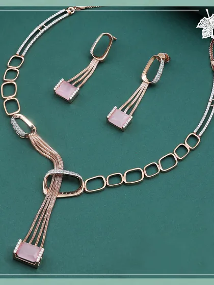 A whisper of romance, our Blush Pink set captures the soft glow of dawn. This contemporary design in rose gold, featuring blush-toned gemstones and fluid lines, is a poetic expression of modern femininity.