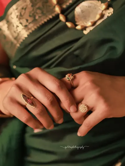 A detailed shot of the bride's hands, adorned with beautiful rings. This type of shot adds a layer of detail to the wedding album, focusing on the small but significant elements.