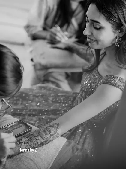 In my element. This is where I am happiest, completely absorbed in the process of creating intricate henna art.