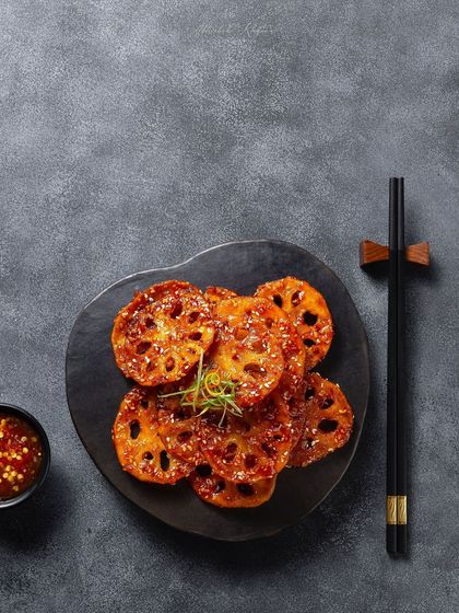 Crispy lotus stem in a sweet and spicy sauce, a minimalist shot for the Zarin menu at Fairmont Jaipur.
