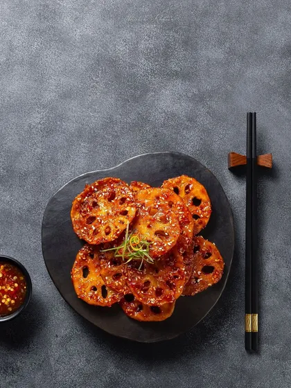 Crispy lotus stem in a sweet and spicy sauce, a minimalist shot for the Zarin menu at Fairmont Jaipur.