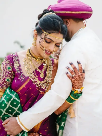 A quiet moment of togetherness for the bride and groom. I focus on capturing the deep connection and emotion in traditional Maharashtrian wedding attire, creating a timeless portrait.