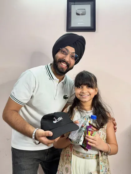 A talented young student receives a cap and other goodies for her excellent performance. Recognizing every student's effort is important to me.