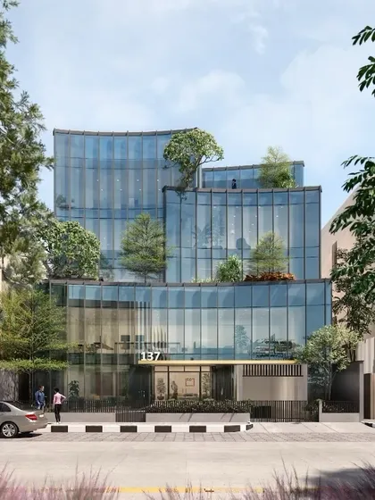 A render for an upcoming commercial project in Koramangala, showcasing a dynamic facade of curved glass and integrated greenery. This design explores the interplay between transparency, nature, and urban context, reflecting our vision for future workspaces.