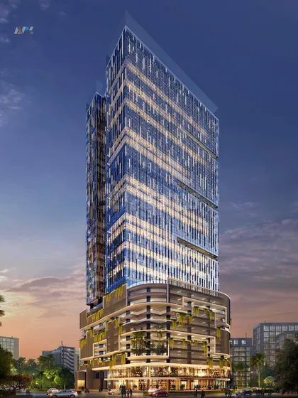 A nighttime render of Codeword Edge. The lighting design emphasizes the building's unique form and its integration of green spaces within the podium levels.