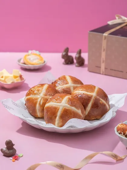 A plate of classic hot cross buns, perfectly baked and glazed. This traditional Easter staple is a nostalgic and comforting treat that I love to make every year.