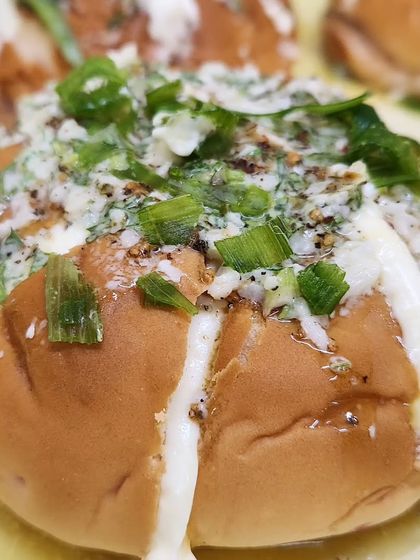 Our Korean Cheese Buns are a savory favorite. These soft buns are filled with cream cheese and topped with a savory garlic and herb butter, making them an irresistible treat for any office gathering.