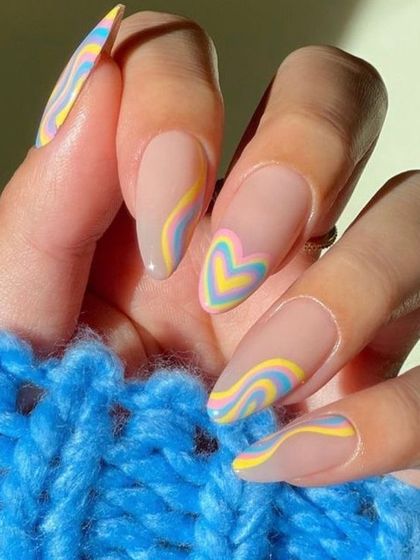 Perfect for summer, this design features wavy lines and a heart shape in pop colors. You will learn how to create playful and trendy nail art that follows seasonal demands.