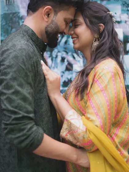 An intimate pre-wedding photo capturing the couple's close bond. The focus is on their happy expressions and the easy chemistry they share.