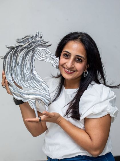 A portrait with one of the "Eternal Horse" heads, showcasing its elegant form and the shimmering diamond details.