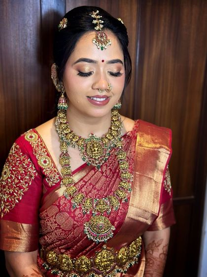 A close-up of this South Indian bride, showing her glowing skin and the intricate details of her temple jewellery.