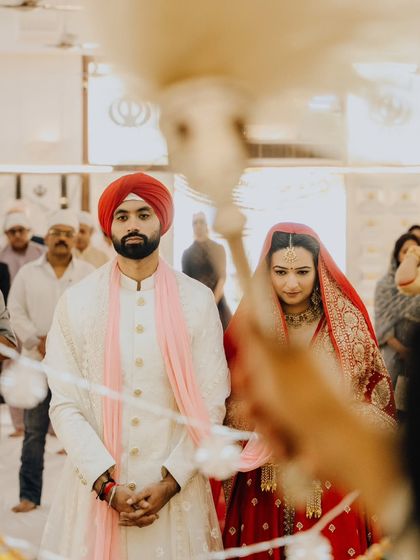 Rahat and Ankita standing in prayer, surrounded by their family. The atmosphere was one of deep reverence and communal blessing.