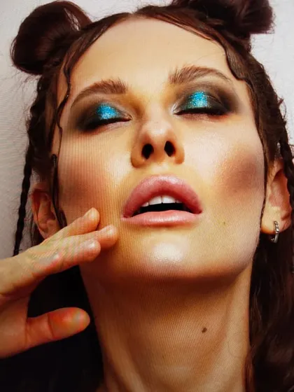 A close-up on a metallic blue and black smoky eye. This look showcases my technique in blending bold pigments for a multi-dimensional effect, perfect for creative beauty stories.