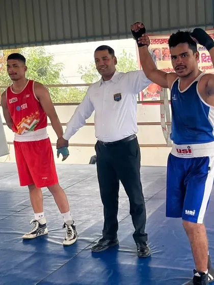 A champion's pose. Rahul Singh after his win, showing the confidence that comes from rigorous training.