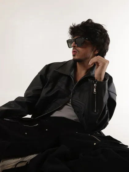 A dynamic pose from the same shoot. These photos are essential for magazine features, interviews, and promotional materials.
