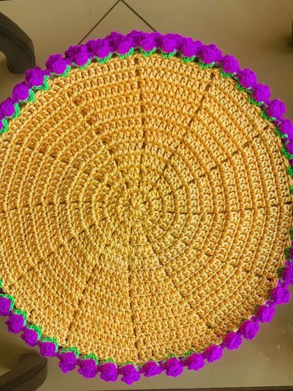 A vibrant yellow doily with a lavender tulip border. This color combination is a real showstopper.