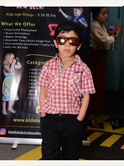 This little guy has his cool look down pat with sunglasses and hands in his pockets. A future star in the making.