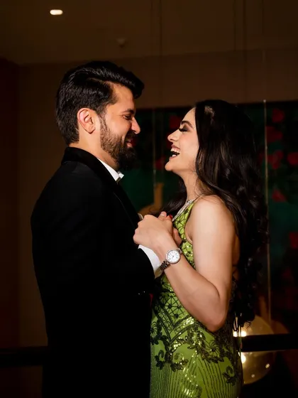 Another angle of the couple's shared laughter, a perfect candid moment that tells a story of their happiness.