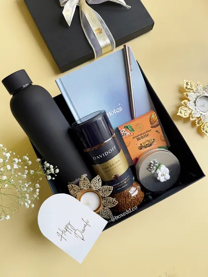 A glimpse into our luxury festive collection. This sleek black hamper for Diwali features premium Davidoff coffee, a matte black bottle, and elegant stationery, showing how we blend tradition with modern sophistication for corporate gifting.