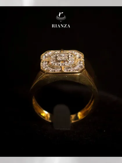 A front view of the men's diamond ring on a display stand, highlighting the cluster of fine-cut diamonds that create a powerful statement.