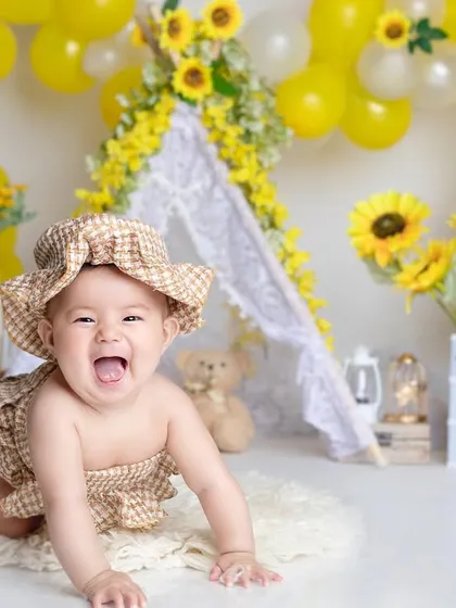 Six months of sunshine! This sunflower-themed half-birthday shoot is so bright and cheerful, just like her smile.