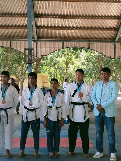 Kim's Taekwondo Academy - Competitive Taekwondo Coaching Our Champions: A Legacy of Medals photo 13