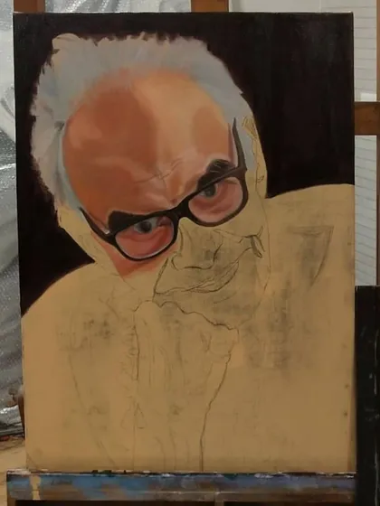 The face is beginning to take shape. I've blocked in the main areas of light and shadow on the forehead and around the glasses.