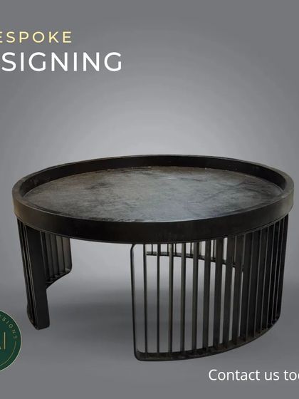 A minimalist coffee table with a semi-circular design and a slatted base. This piece is a great example of bespoke designing, offering a unique shape and texture for a modern living space.