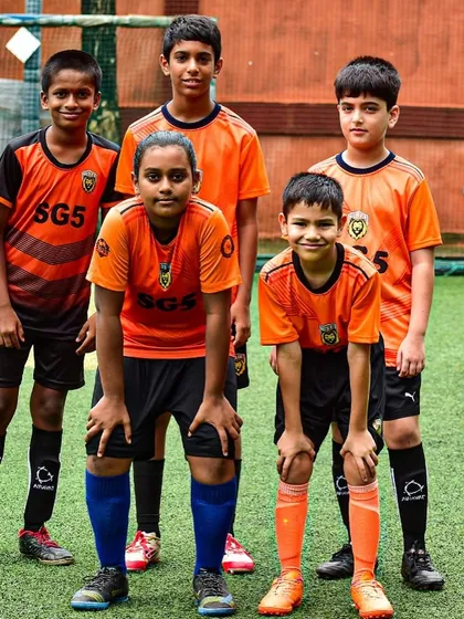 A youth team in their official SGS kits, showing the unity and identity we build through our events.