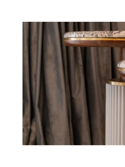 A detail of the custom side tables, showing the layered design of wood, fluted texture, and marble.