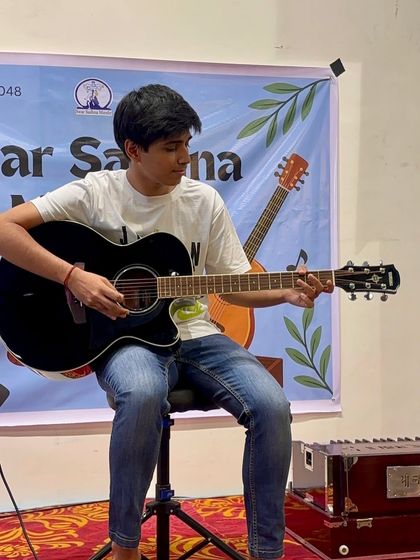 Another one of our dedicated guitar students performing for the audience. Each performance is a testament to their hard work and our practical teaching methods.